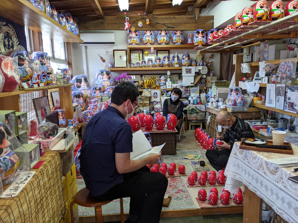 Mr and Mrs Hongo at Hongo Daruma-ya studio making Matsukawa Daruma dolls