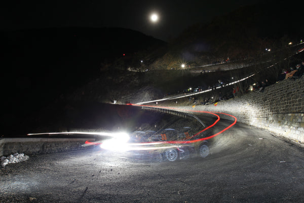 Long exposure photograph of a rally car at Rallye Monte-Carlo