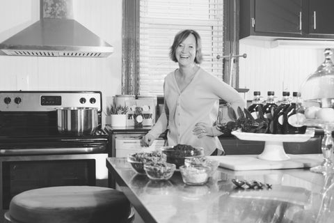 Jen Haseloff, owner of Sweet 'n SImple Elderberry, making elderberry syrup in a commercial kitchen