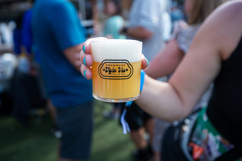 picture of a beer glasses in aspen reading snowmass rendevous 