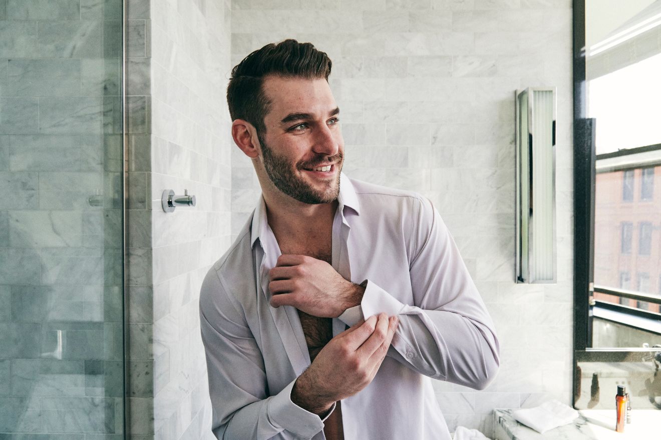 Man getting ready in bathroom