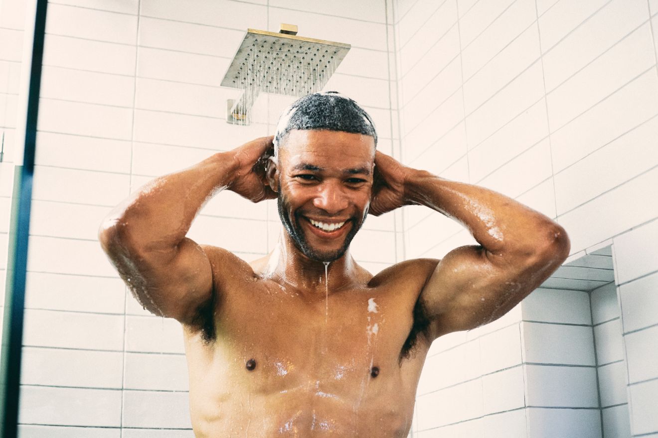 Man smiling in shower