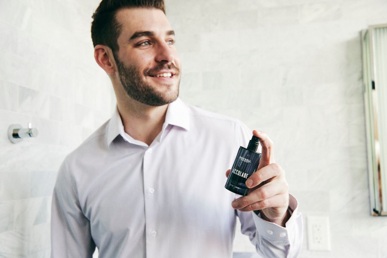 Man applying cologne