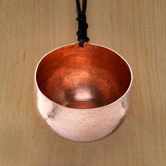 hand hammered copper mug with leather cord