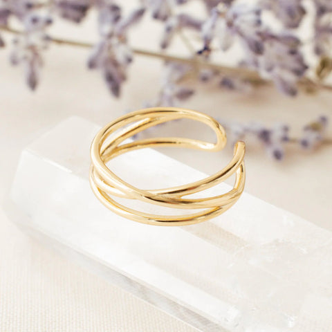 Gold Wrap Ring laying on a crystal