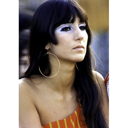 Cher wearing large and think hoop earrings