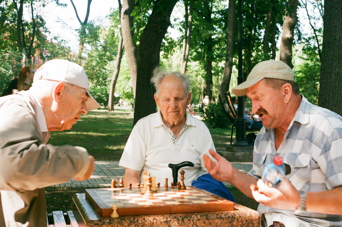 Image showing elderly men playing chess in the park.