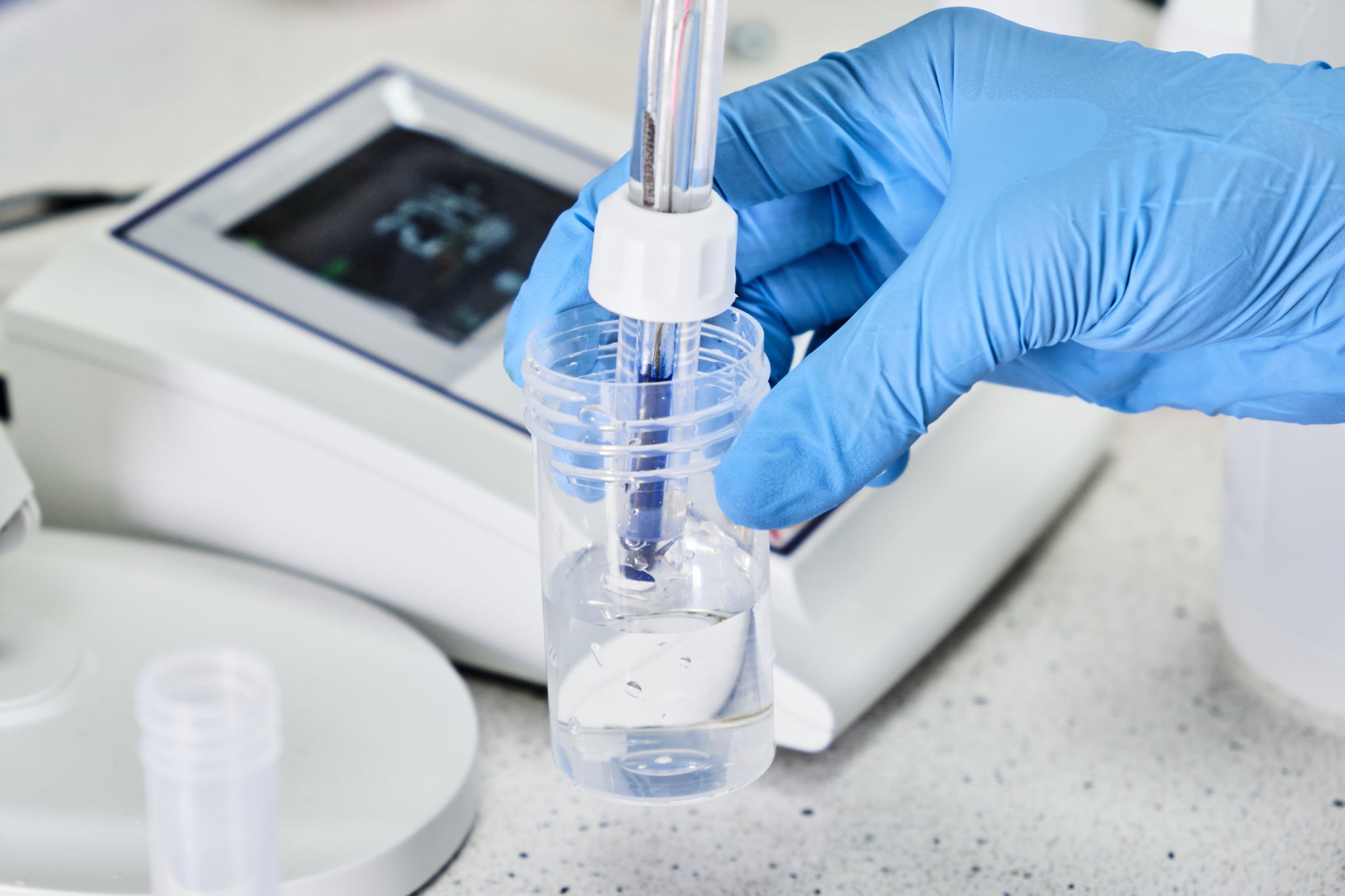 Scientist testing hypochlorous acid in a lab