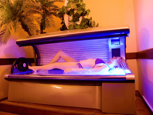 an image of a woman using tanning bed.