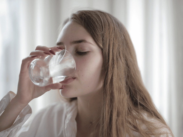 an image of a woman drinking water.