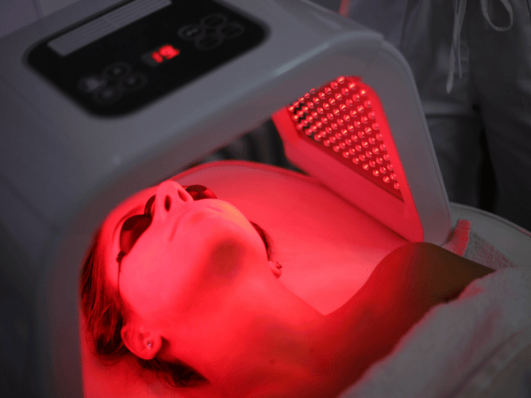 an image of a woman getting red light therapy.