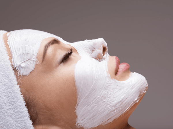 an image of a woman getting facial treatment.