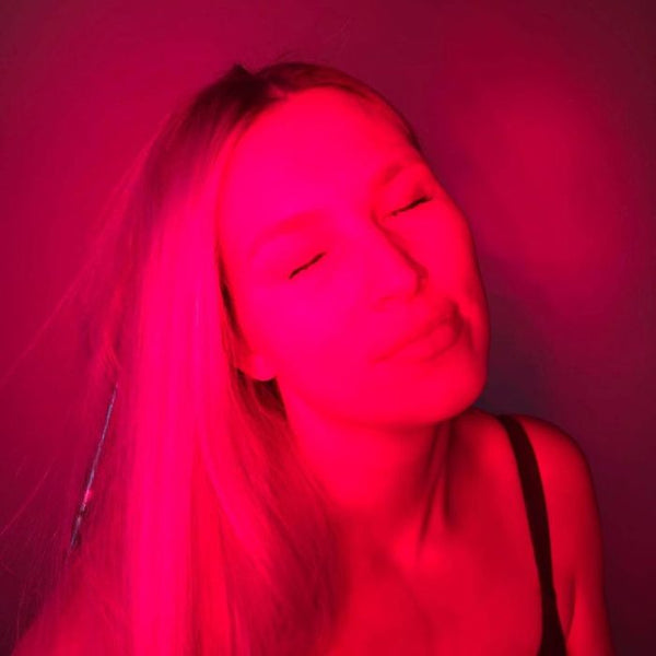 an image of a woman getting red light therapy