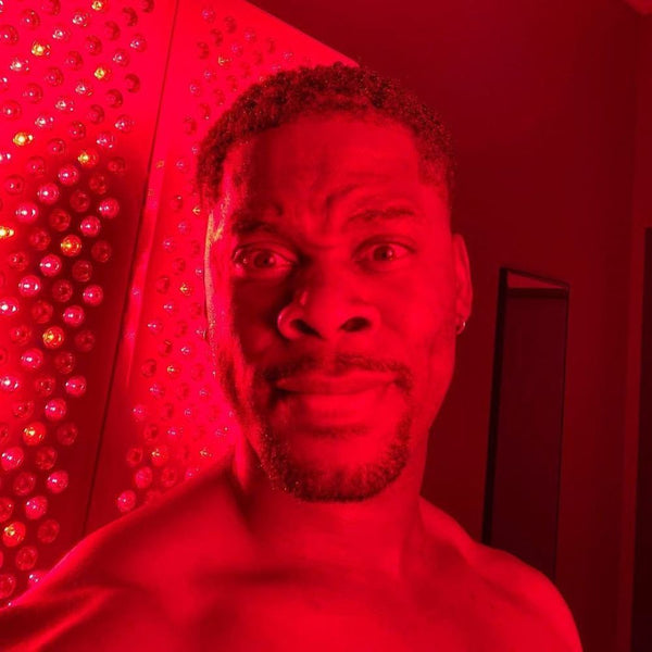 an image of a man using Koze Red light therapy