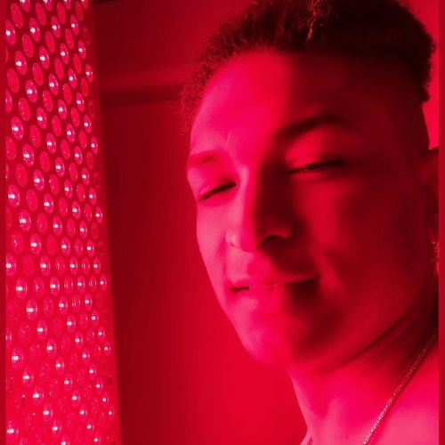a man being exposed to red light treatment.