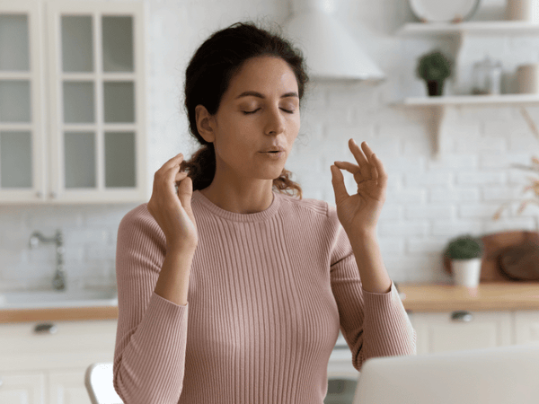 an image of a woman meditating.