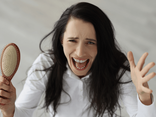 an image of a woman screaming in stress