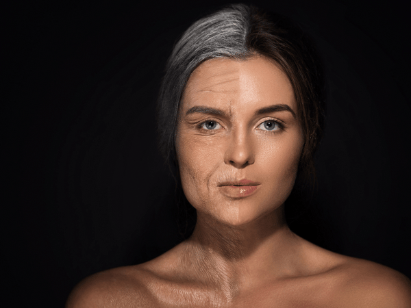 a split image of a woman with youthful skin and old skin.