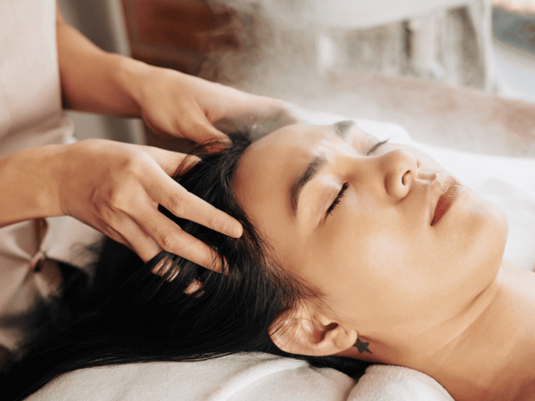 an image of a woman getting scalp massage.