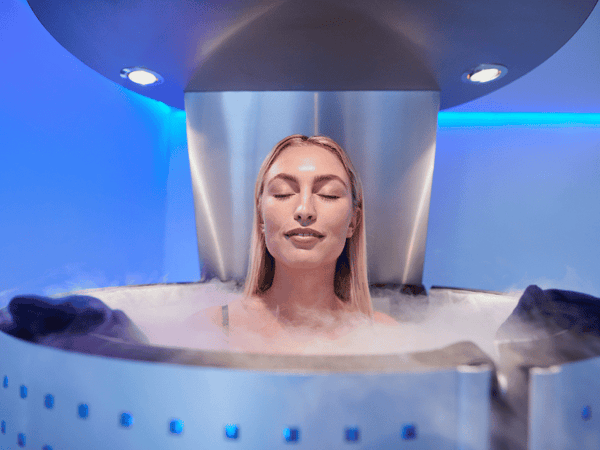 a woman undergoing a Whole Body Cryotherapy (WBC).