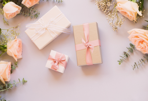Ehlers Danlos Syndrome Gifts: three gift boxes with pink roses around them