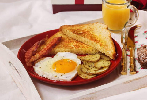 Chronic pain and relationships: A tray on the bed with delicious looking breakfast