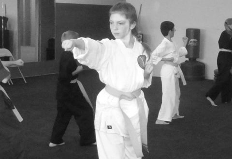 Brie as a child, practicing martial arts