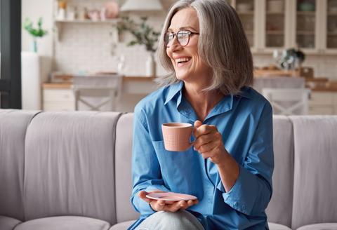 best bras for limited mobility: a woman comfortably enjoying a coffee at home