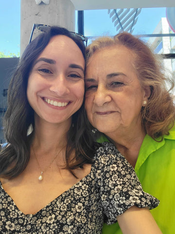 Young, dark-haired woman and her grandmother, who has red-blonde hair