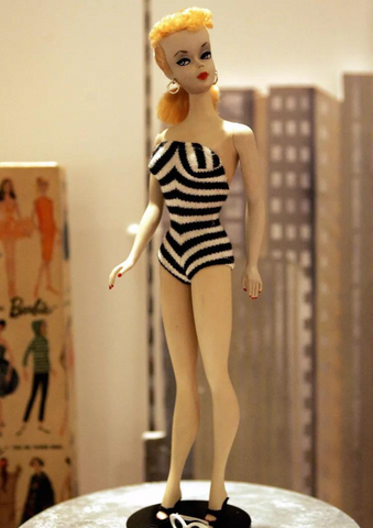 The first Barbie doll was unveiled at the American International Toy Fair in New York City. She sported a black and white striped swimsuit, high-heeled shoes, and a signature ponytail. With her stunning looks and fashionable outfits, Barbie quickly became a sensation.