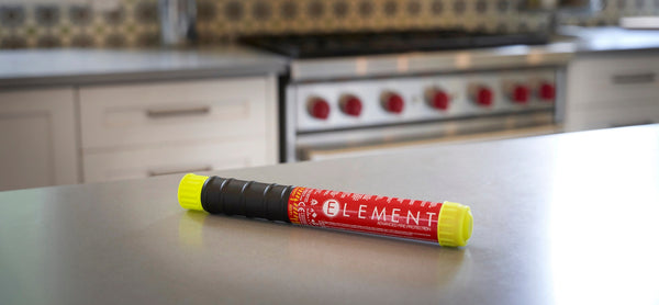 Element Extinguisher resting on a kitchen shelf ready to be used