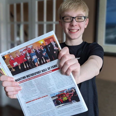 Keaton holding up the magazine he was featured in