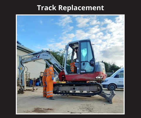 Engineers replacing tracks on the Takeuchi digger