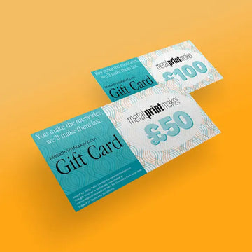 A pack shot of two gift vouchers for the Metal Printmaker store one for £50 and one for £100 on an orange background