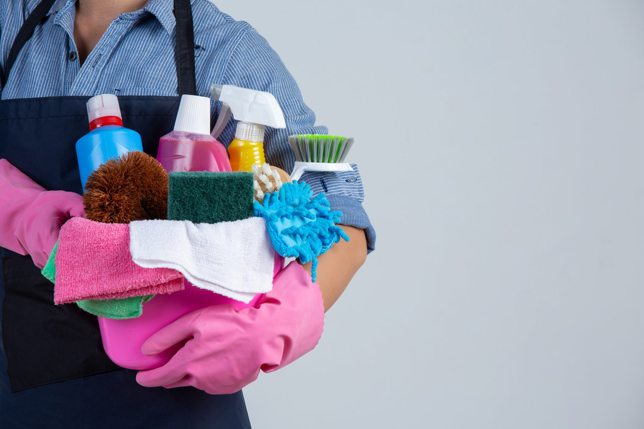 Person carrying cleaning products