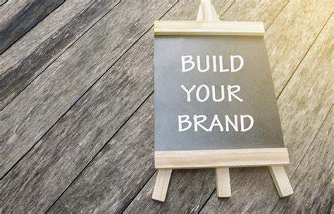 street banner saying Build your brand written in chalk on a board