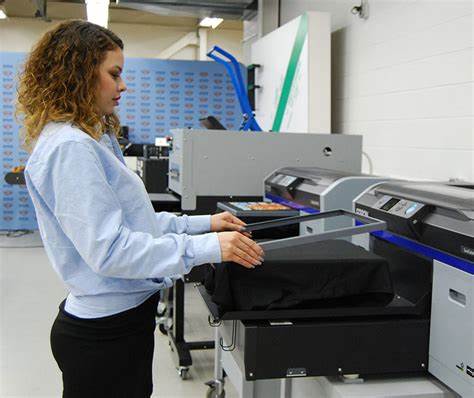 woman working at a DTG printer