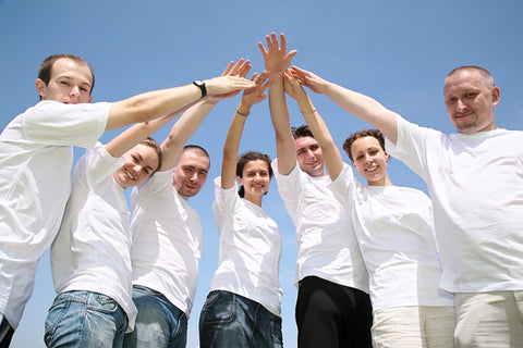 a group of people with their hands link together
