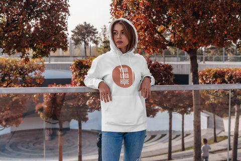 woman wearing a custom printed hoodie in front of an autumn coloured scene