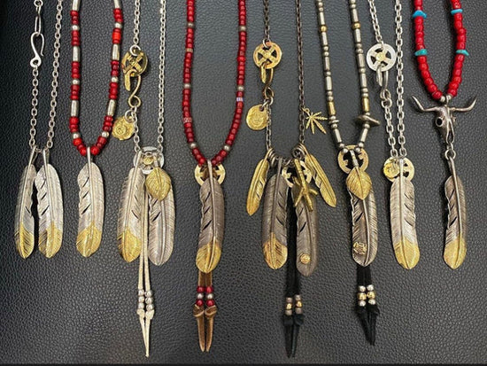 goros feather pendant on the hands