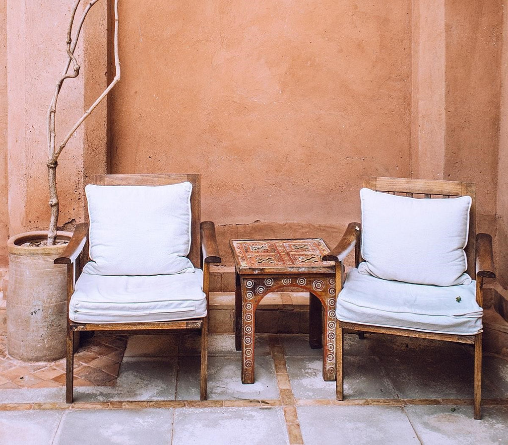 two patio seats with a small table