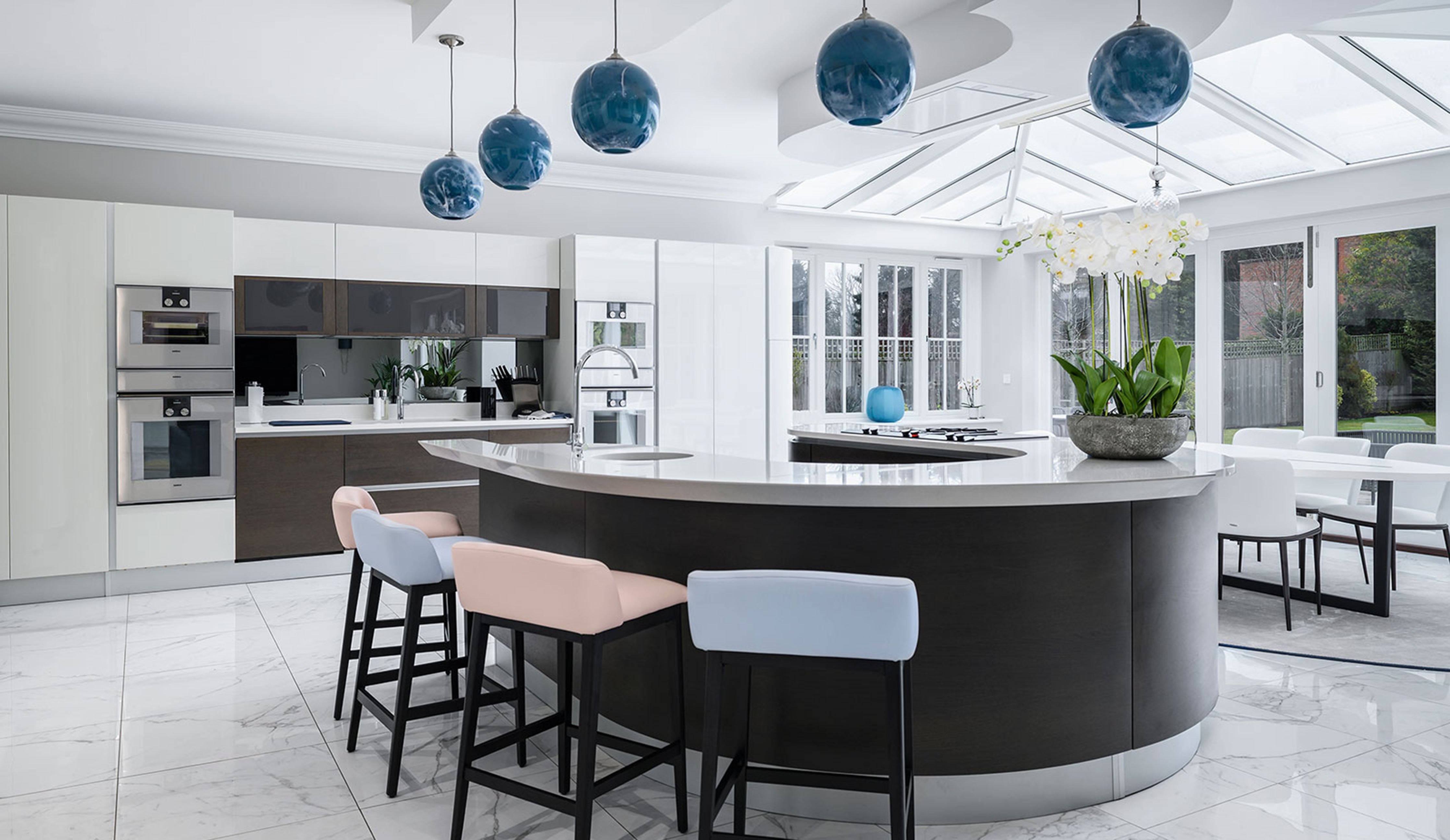 Rothschild &amp; Bickers Lazurite Mineral glass pendant lighting hanging over a kitchen island