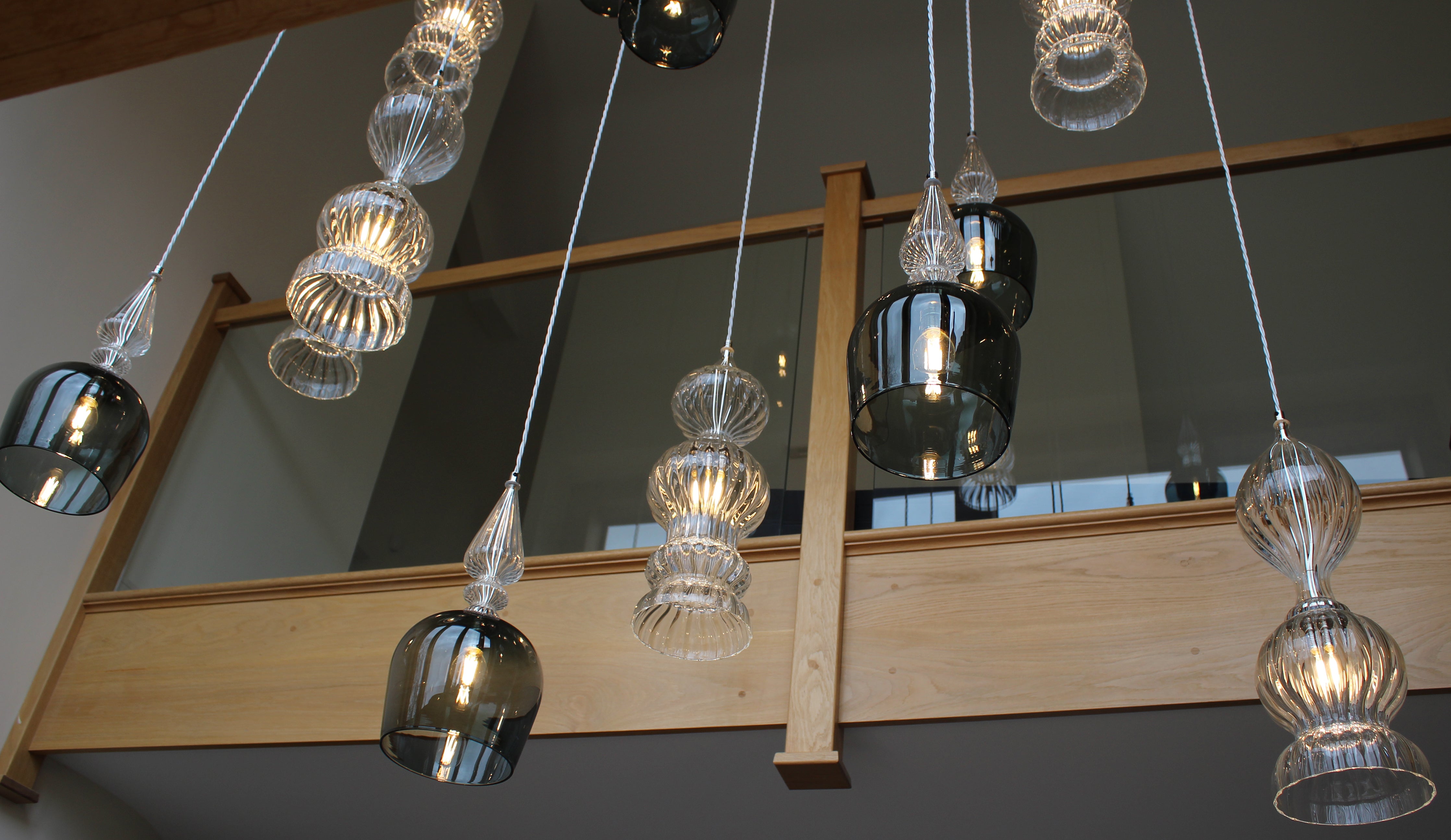 Large cluster of Spindle shades and pendants by Rothschild &amp; Bickers for entrance hall and stairwell