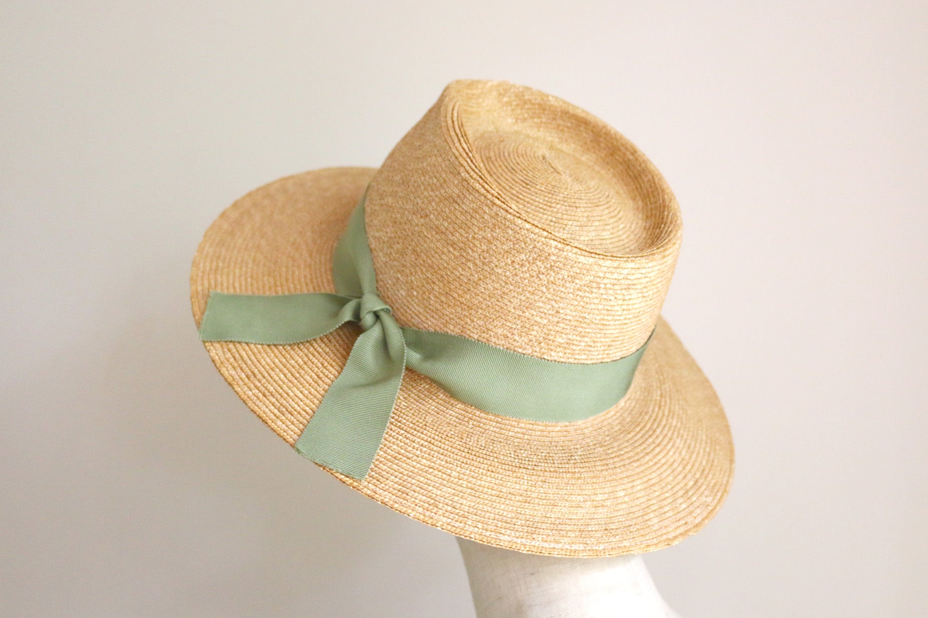 straw hat with green ribbon