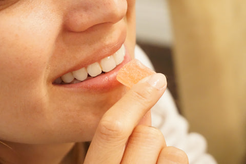 Woman eating gummy