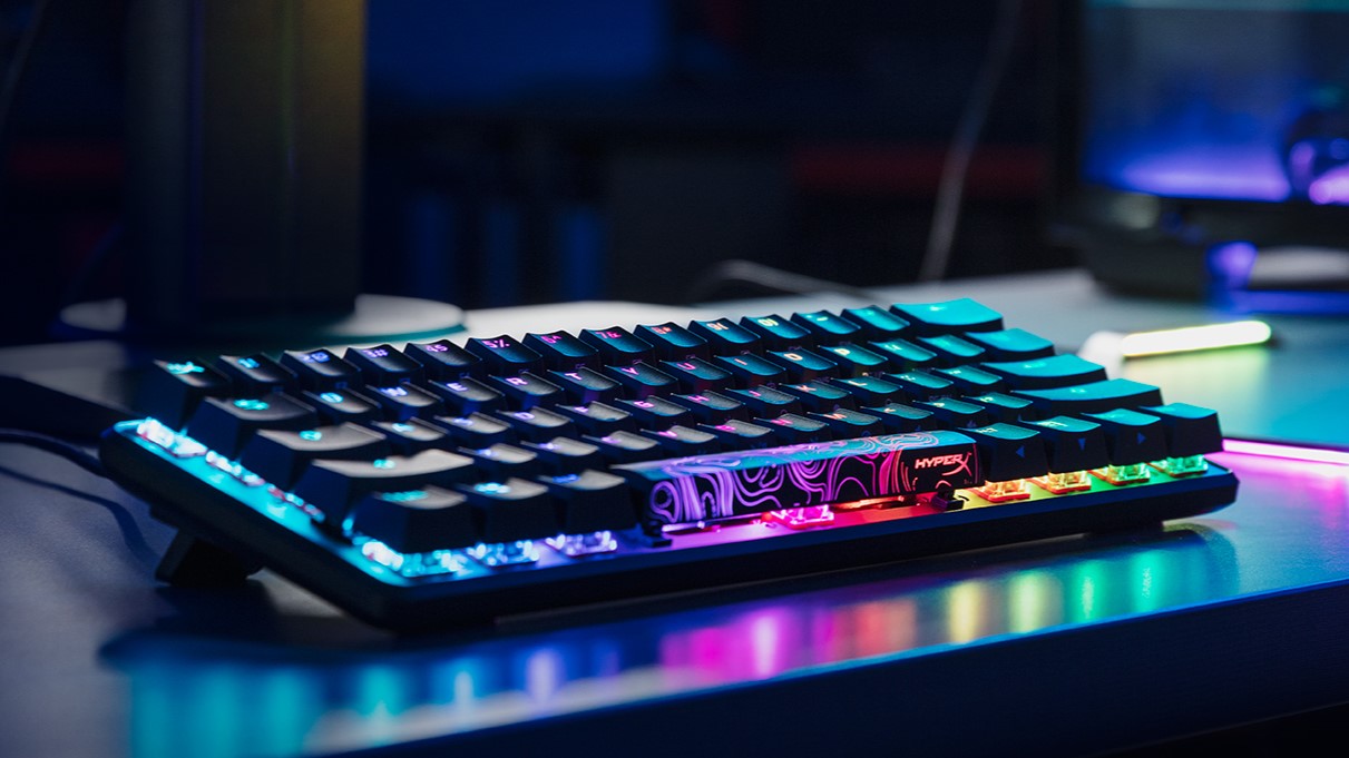 HyperX Alloy Origins 60 featured on a desk with RGB lighting on