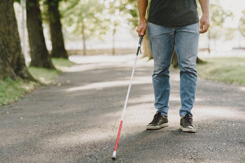 image of man walking with a cane