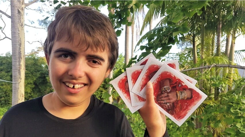 Luca holding his greetiung cards