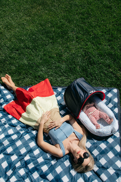 Mommy and baby outside on the grass