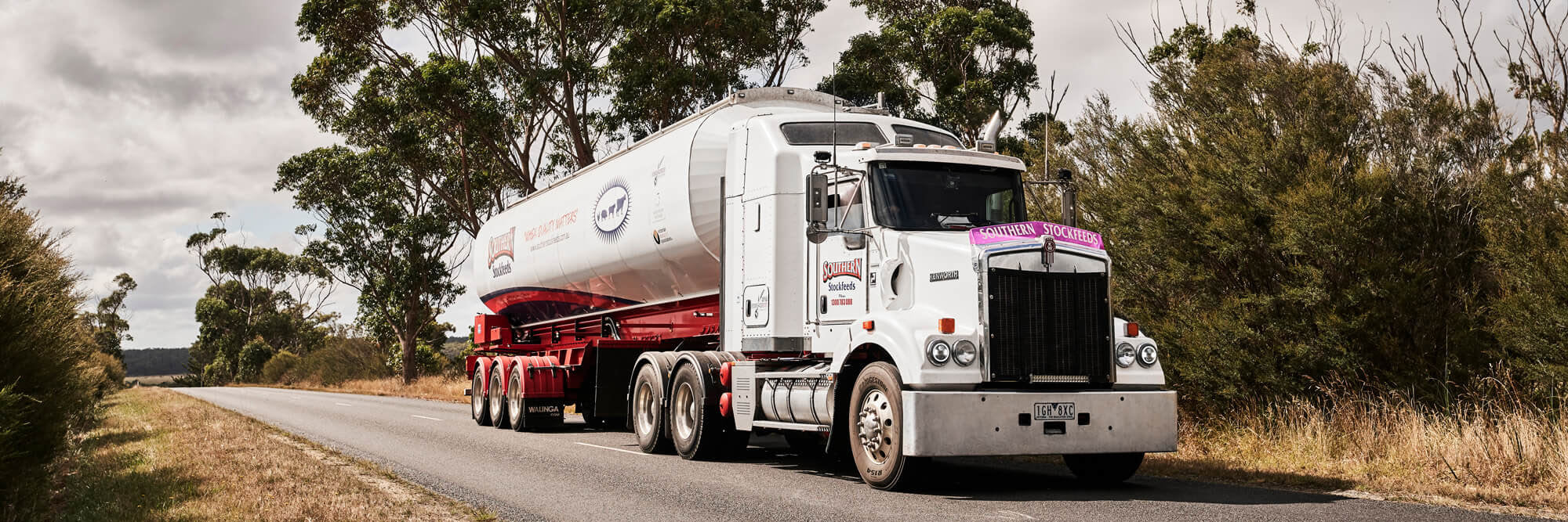 A SOuthern Stockfeeds Truck Driving on a Country Road Through Gippsland to Deliver Stock Feed to a Dairy Farm